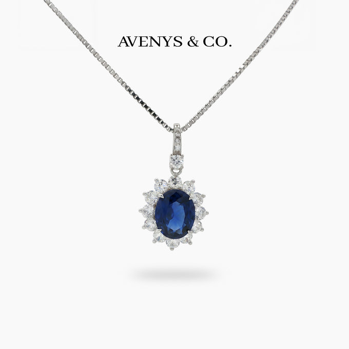 Classic Halo Necklace with Blue Oval Stone – on White Gold