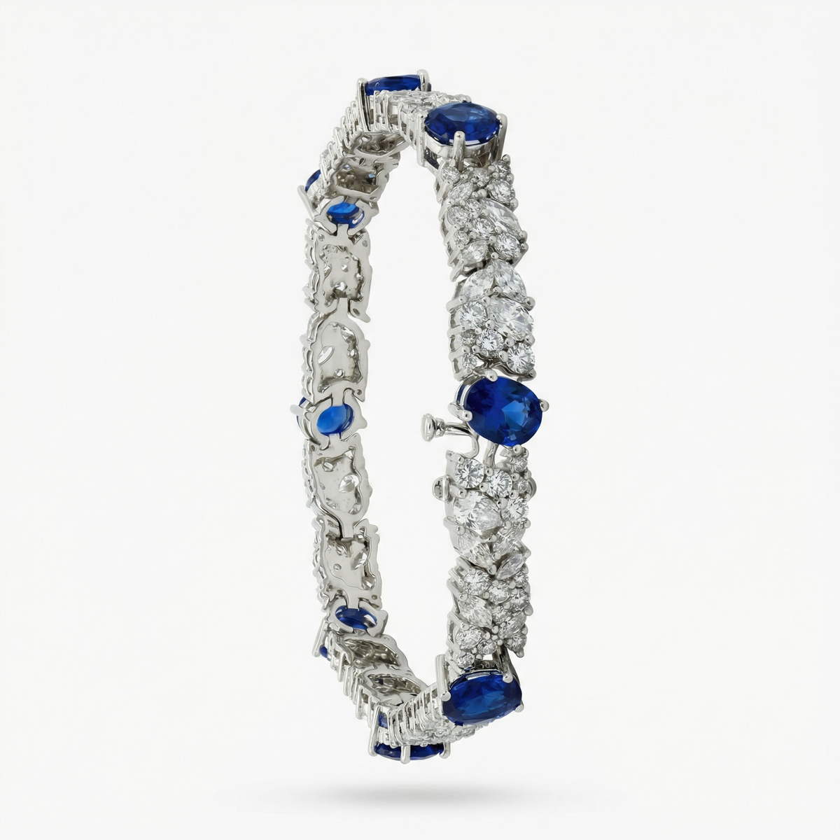 White Gold Tennis Bracelet with Deep Blue Oval Sapphires