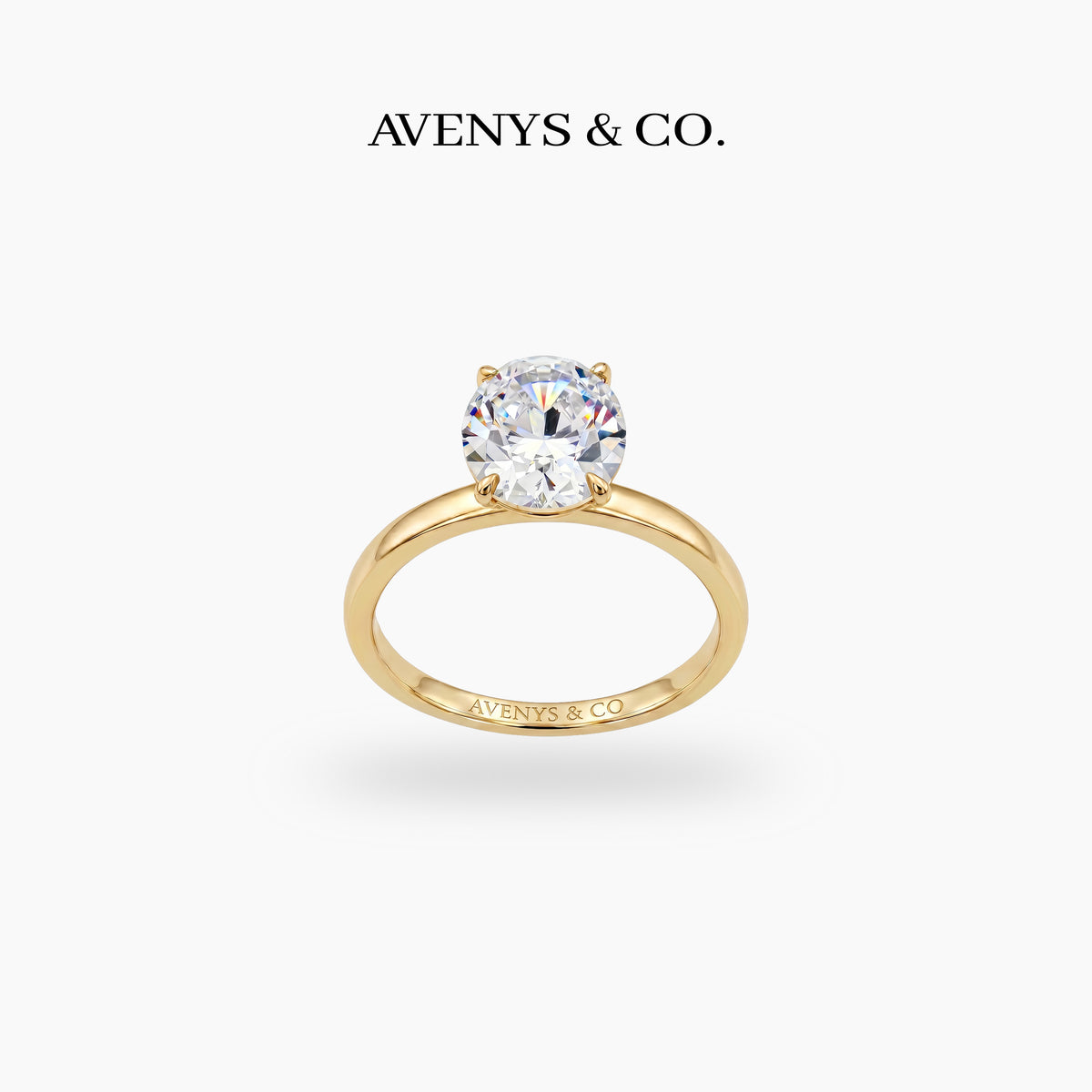 Oval Solitaire Ring with White Oval Stone – on Yellow Gold