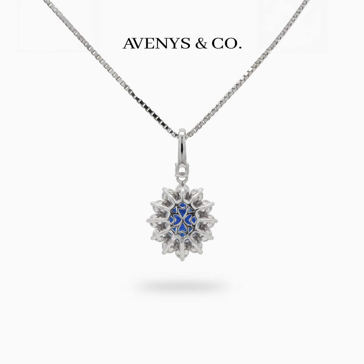 Classic Halo Necklace with Blue Oval Stone – on White Gold