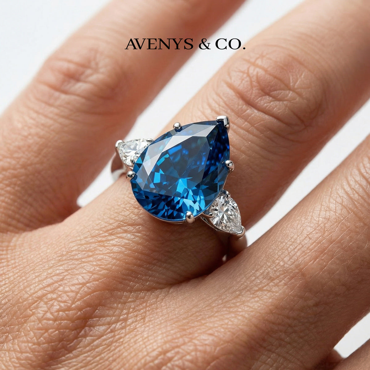 Pear Trilogy Ring with Blue Pear Stone – on White Gold
