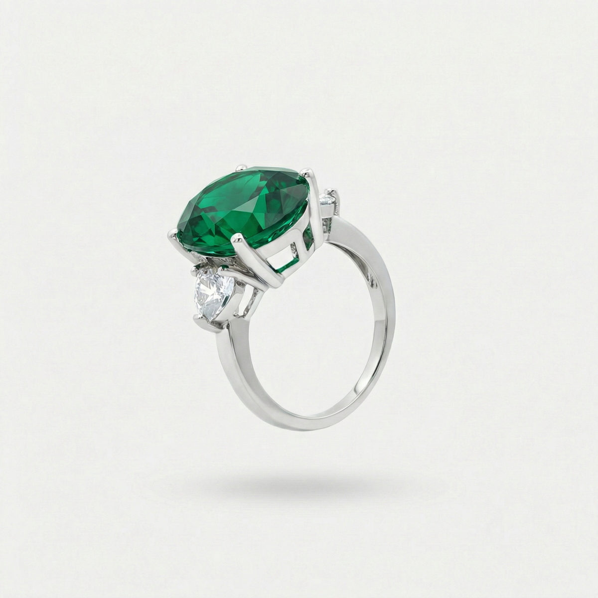 Oval Trilogy Pear Ring with Green Oval Stone – on White Gold — Ring profile/back angle not present in current six