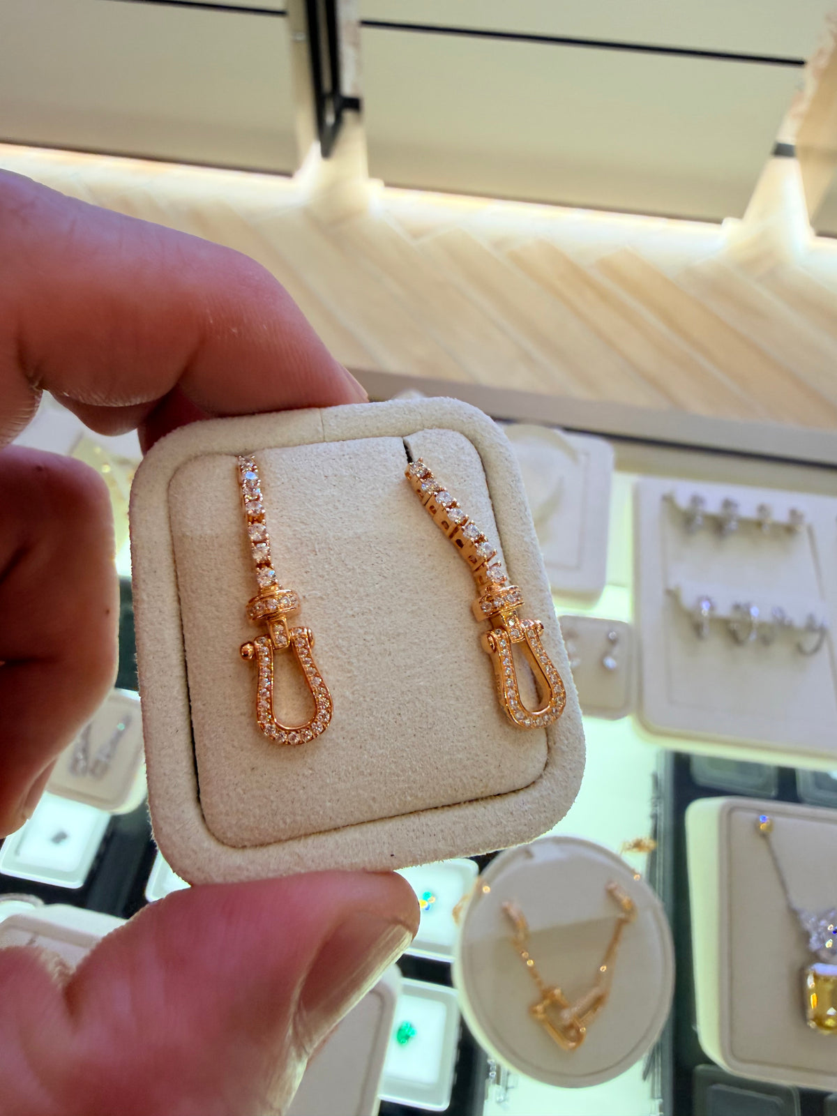 Original owner reference — Yellow Gold U Link Drop Earrings in the foreground. Background jewellery and the display holder are not included.